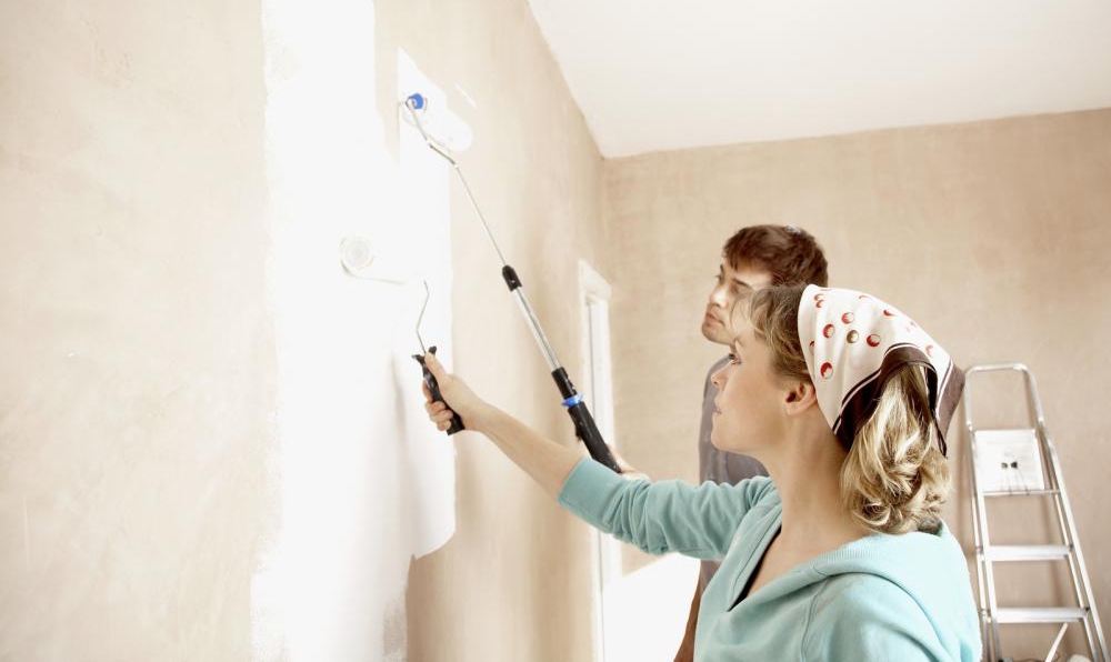 Homeowners painting walls white