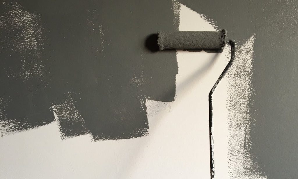 a picture of a grey wall being painted 