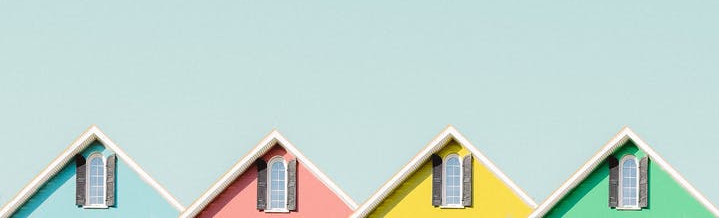 a picture of four colorful houses 